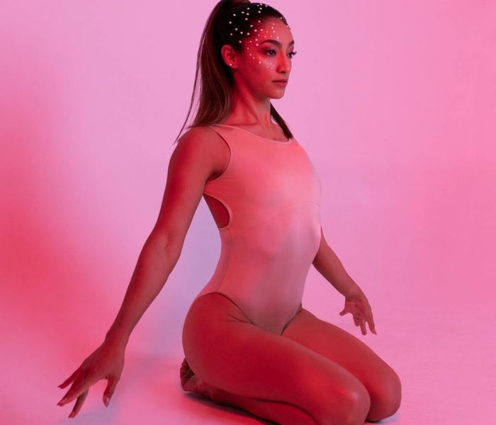 Woman in a graceful yoga pose, serene and balanced.